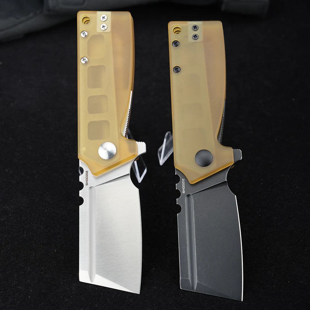 SHOOZIZ HAN307-JUS and HAN307-JUB folding knives open, comparing satin and black PVD D2 steel blades with translucent yellow Ultem handles, black background.