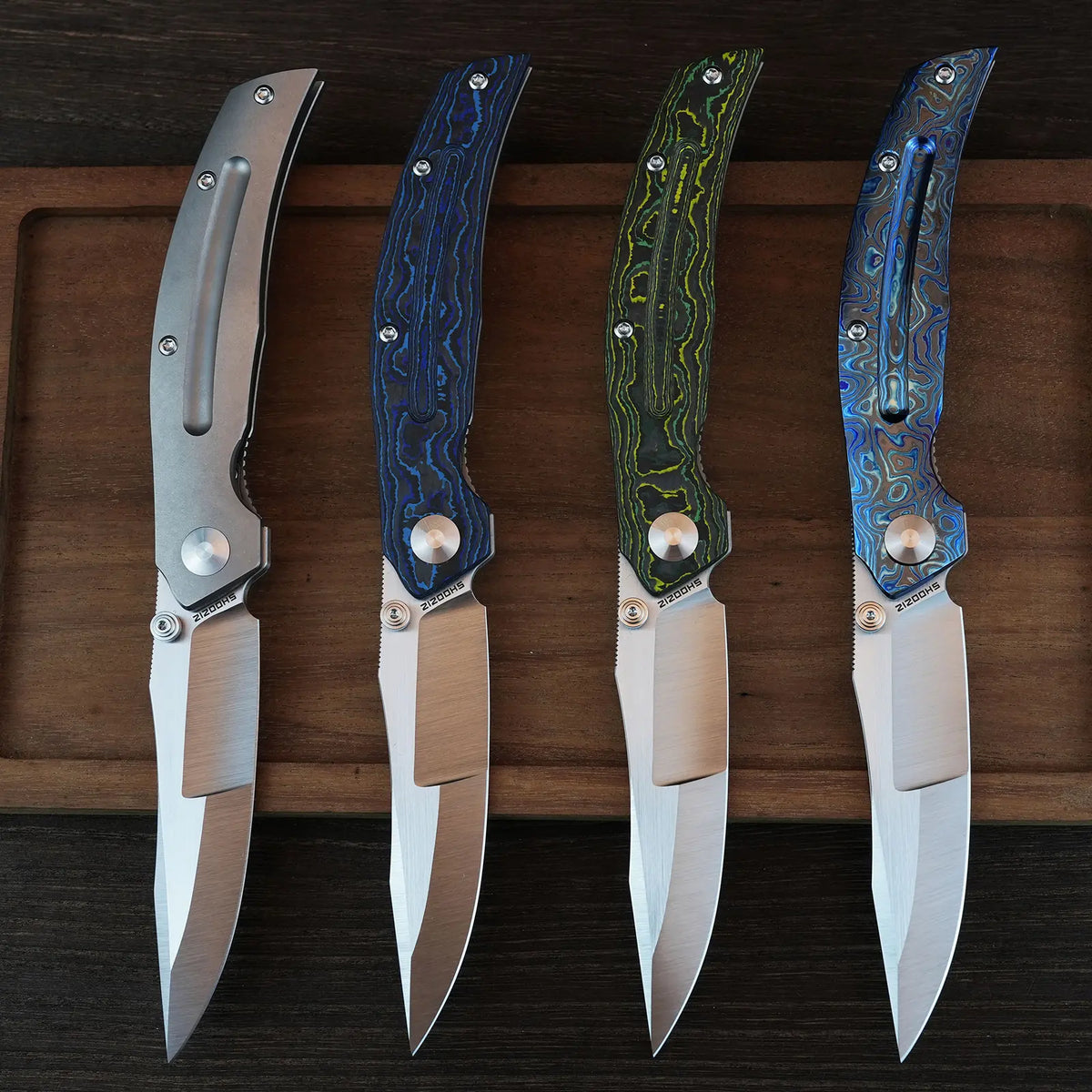 SHOOZIZ SERPENT series lineup on wooden board, featuring TC4 titanium, blue carbon fiber, yellow carbon fiber, and zirconium Damascus handles with ELMAX steel blades.