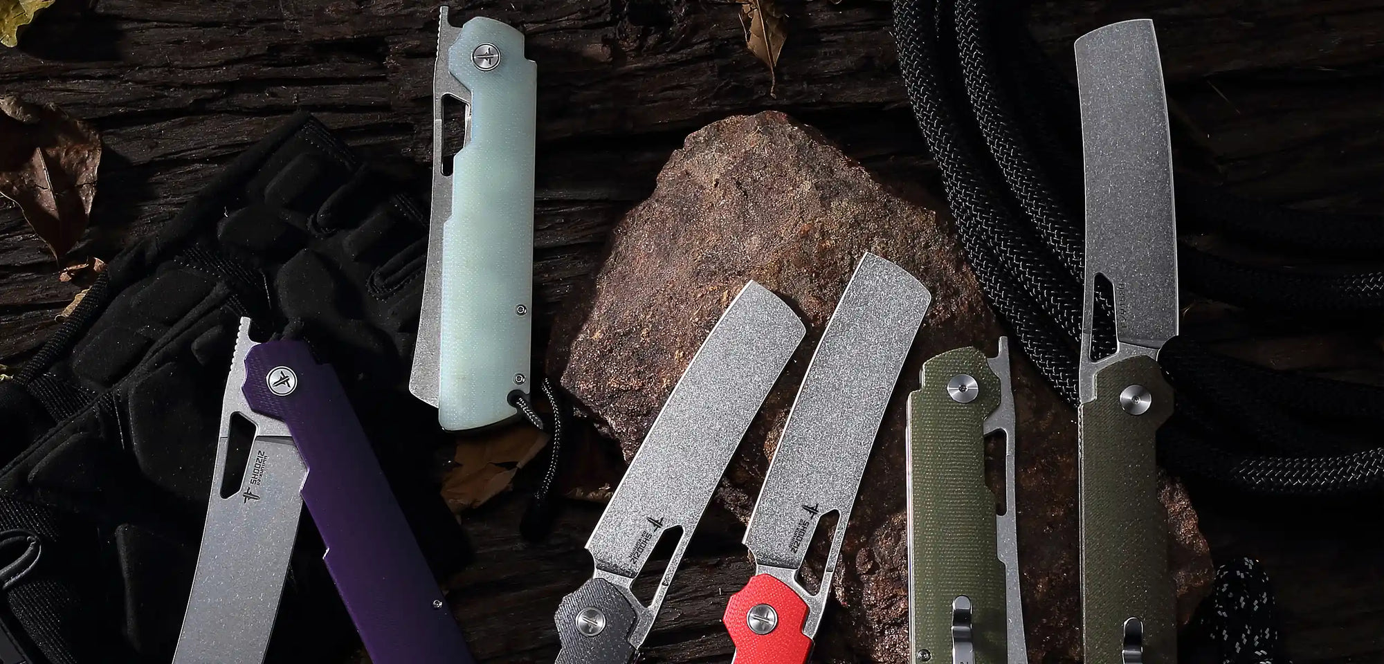 Desktop banner showing multiple SHOOZIZ XUN119A folding knives from the XUN Series. Stonewash or satin D2 blades with jade G10, Micarta, and Ultem handles. Tactical EDC folders for everyday carry and outdoor adventures.