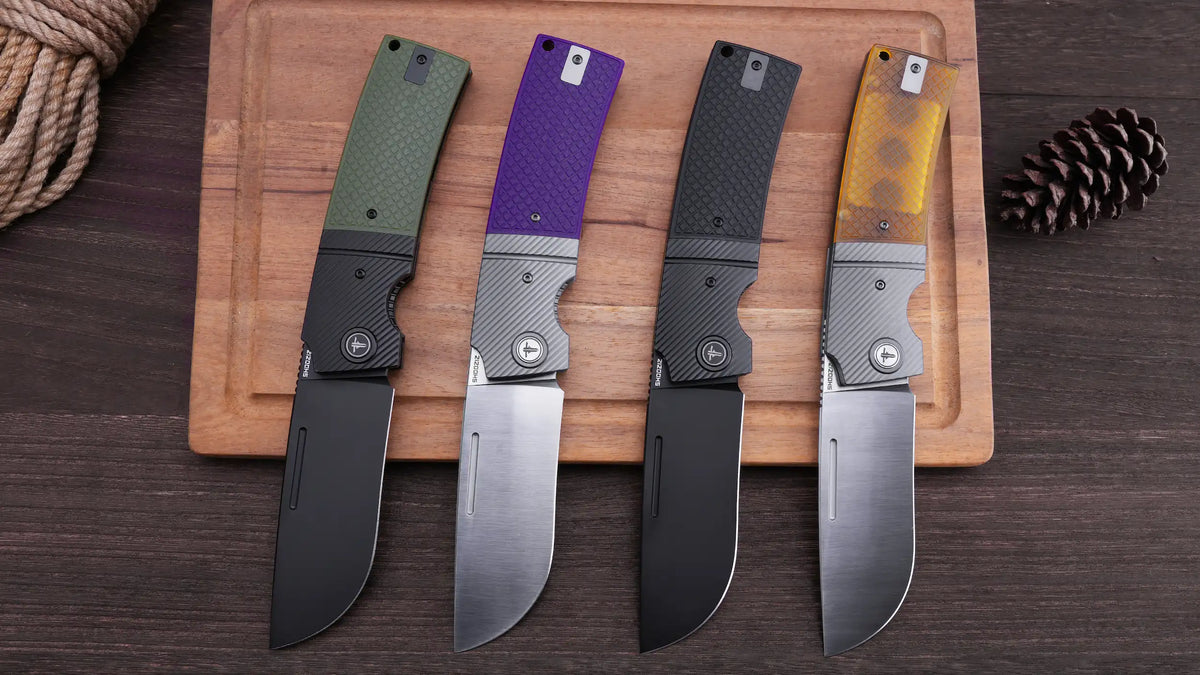 SHOOZIZ XUN120 series models on a wooden board, featuring green G10, purple G10, black G10, and translucent yellow Ultem handles with satin and black PVD D2 steel blades.